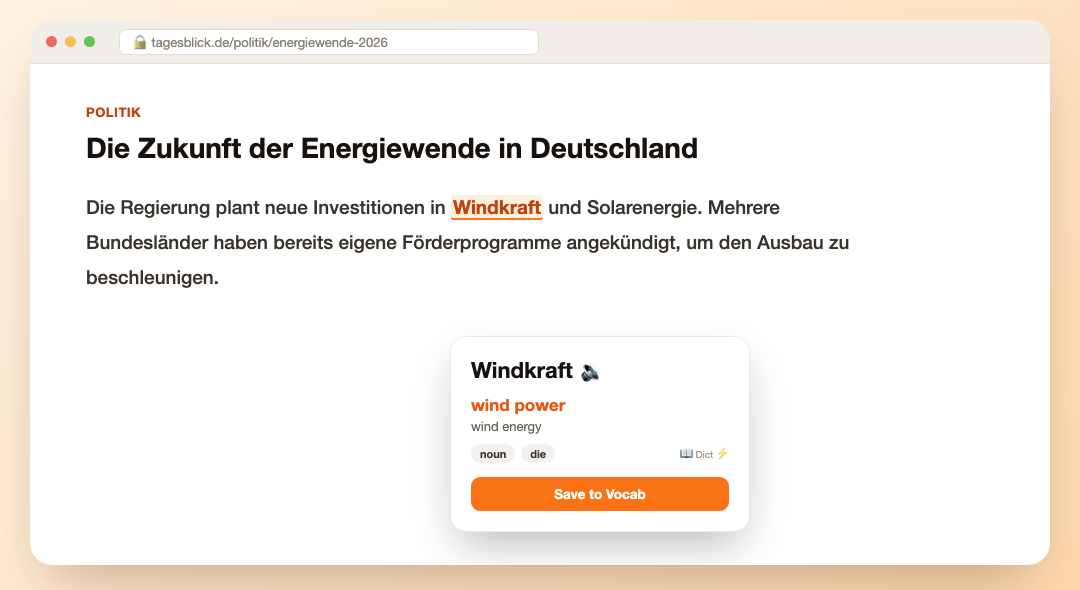 A dictionary card for the word Windkraft open over a German news article